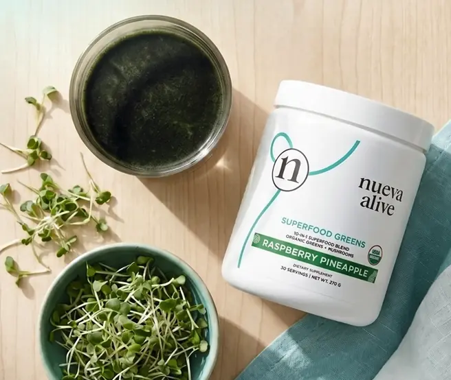 Nueva Alive superfood greens with a prepared green drink